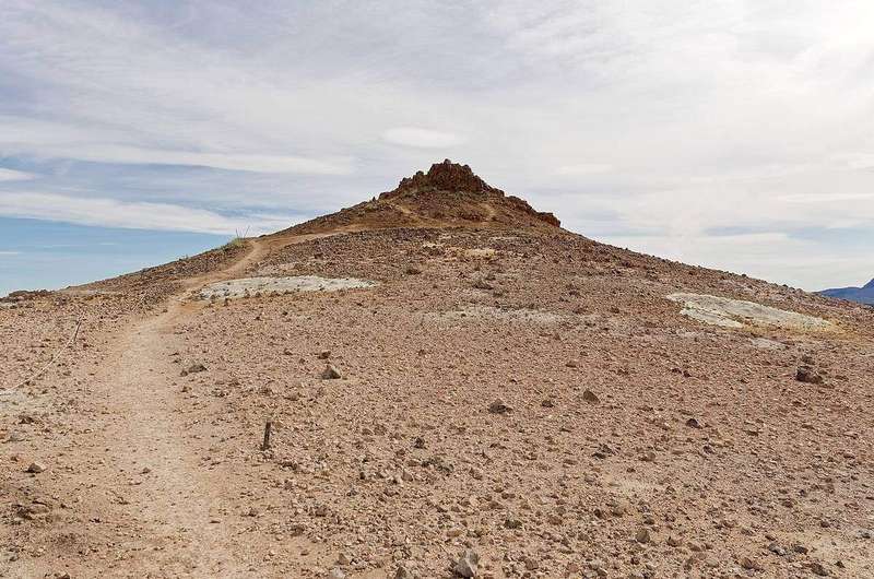 A hiking trail winding through mountain terrain