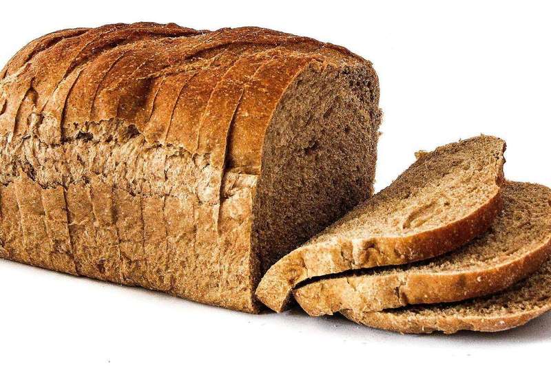 Fresh loaves of bread cooling; freezing preserves softness far better than refrigerating