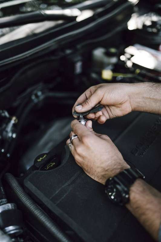 A mechanic inspecting a car engine