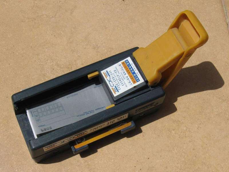 A vintage credit card imprinter, from the era before grace periods were standardized