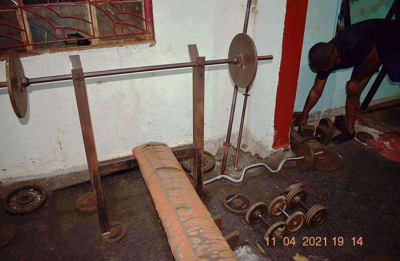 A barbell and dumbbells in a health club