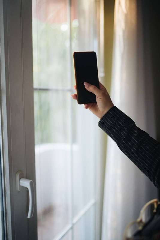 Close-up of a woman holding a mobile phone