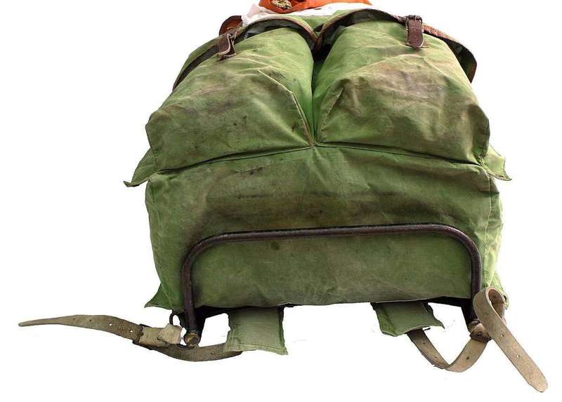 A travel backpack packed for a long trip, with compression keeping its profile slim