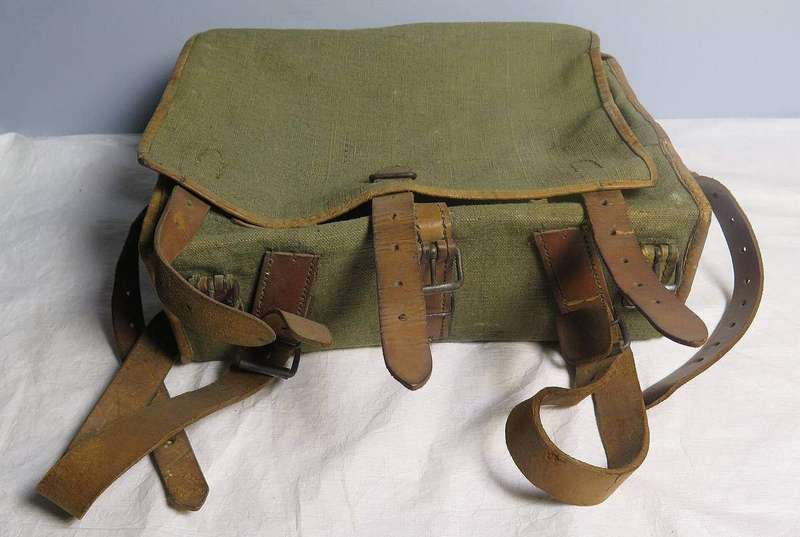 A travel backpack photographed to show its size and shape against a plain background