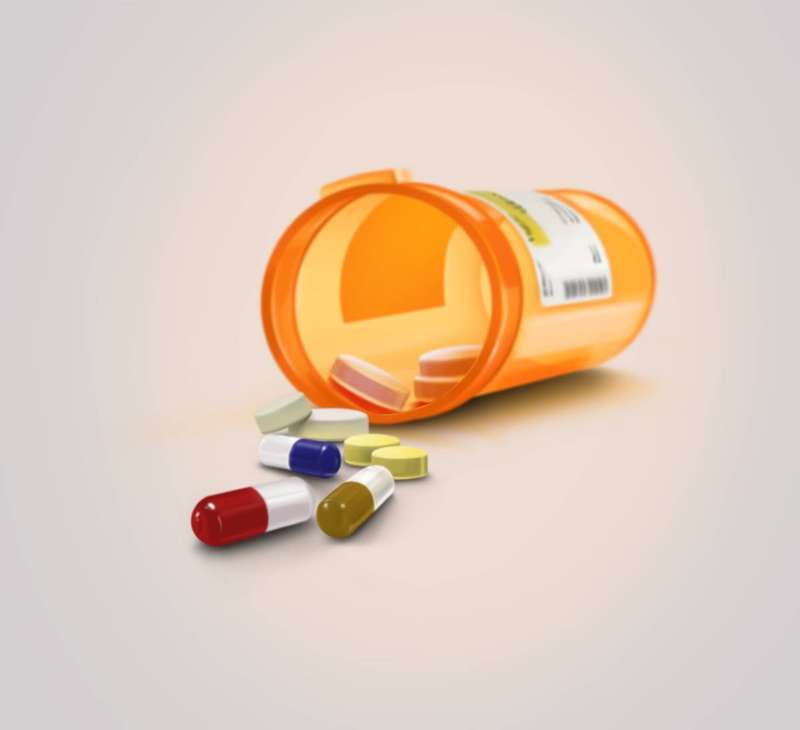 Spilled pill bottle with capsules