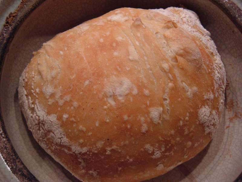 A finished loaf of bread with a golden-brown crust formed by the Maillard reaction