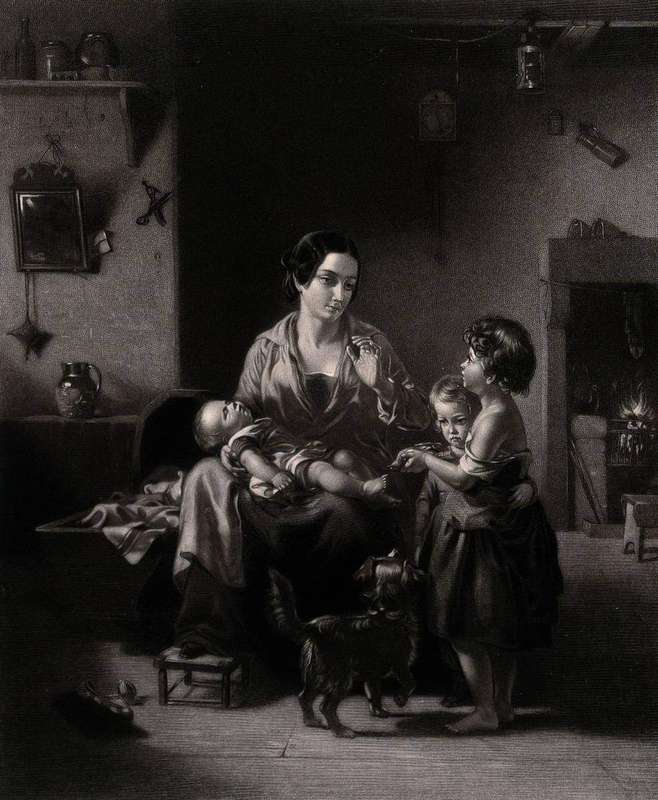 A mother holding her sleeping baby