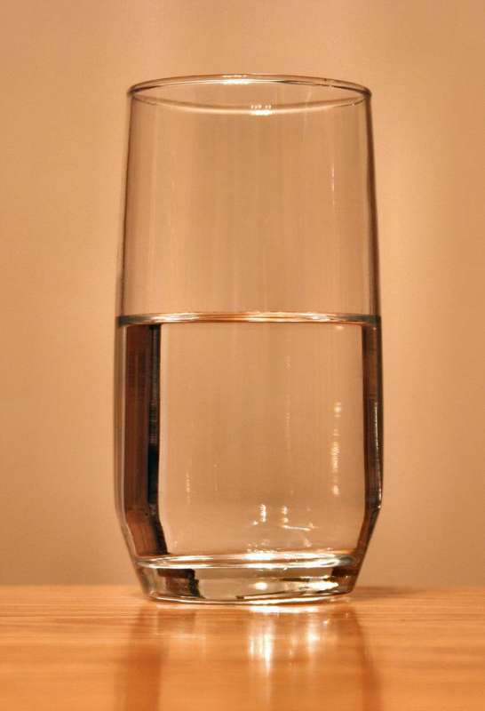A clear glass of water, a reminder of how much pregnancy raises the body's fluid needs