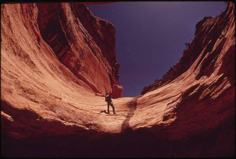 Hikers navigating by map and compass in the Maze district of Canyonlands