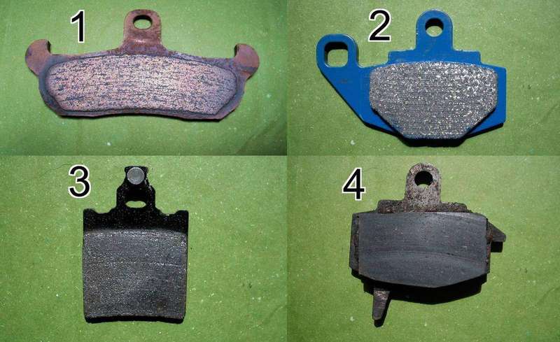 A close-up of brake pads removed from a caliper
