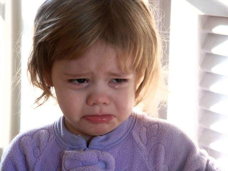 A crying toddler expressing big emotions