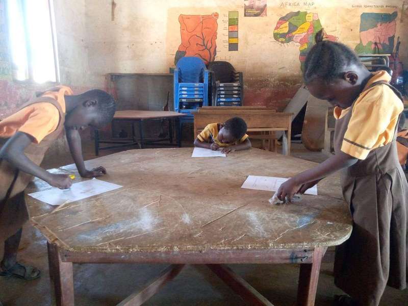 Students writing notes in a classroom