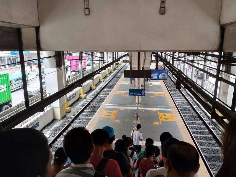 A steep station stairwell seen from above