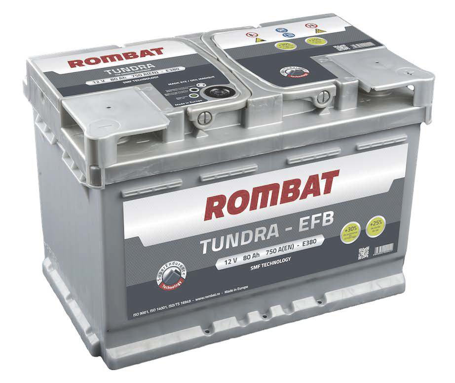 A close-up of a car battery with its terminals and labels