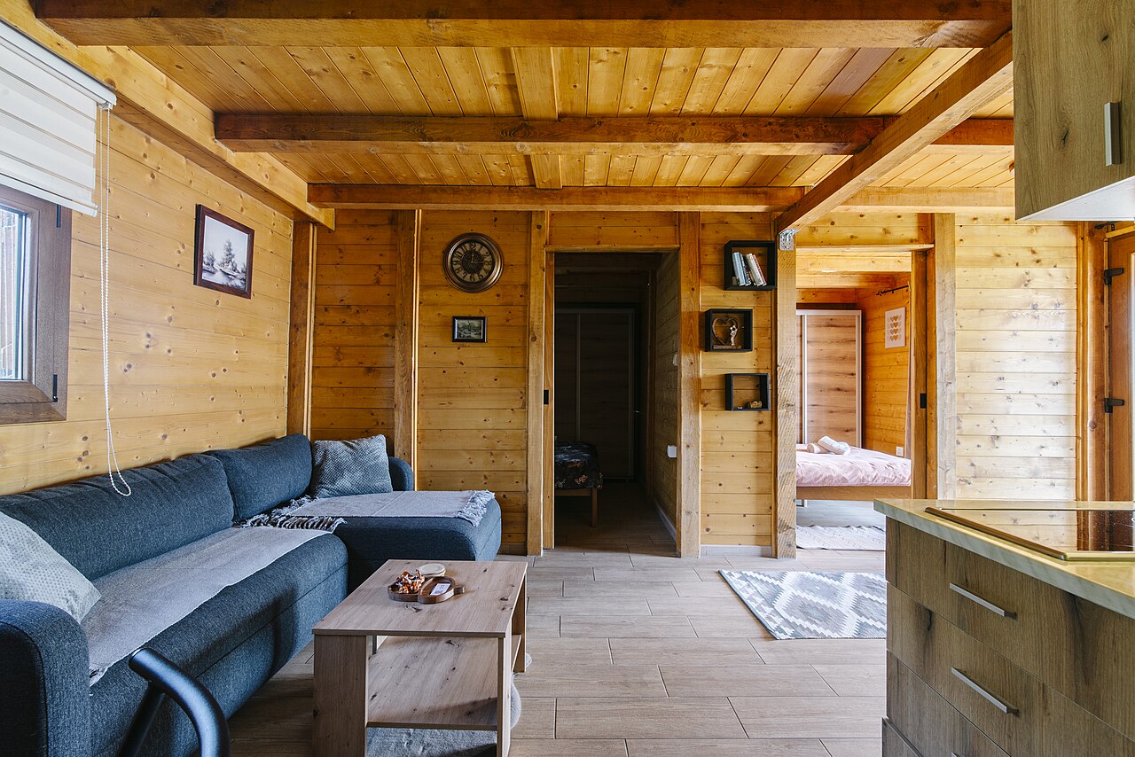 Wooden interior of a cabin room with doors and paneling