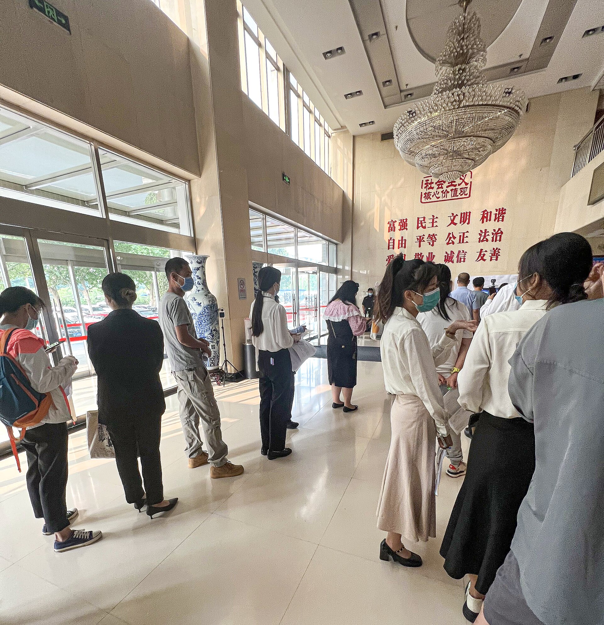 Interviewees queueing in line for a job interview