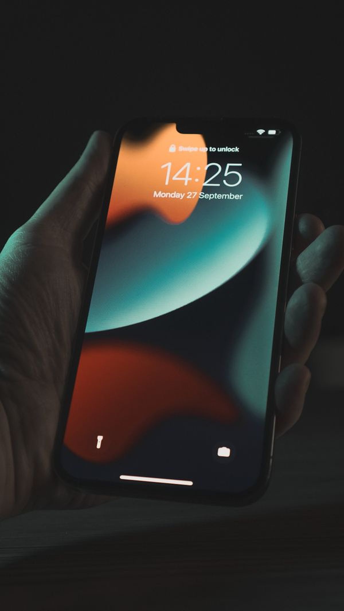 Close-up of a person holding an iPhone