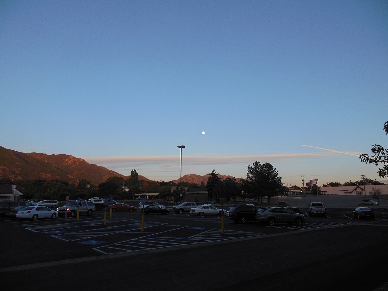 Why is the Moon sometimes visible during the day?