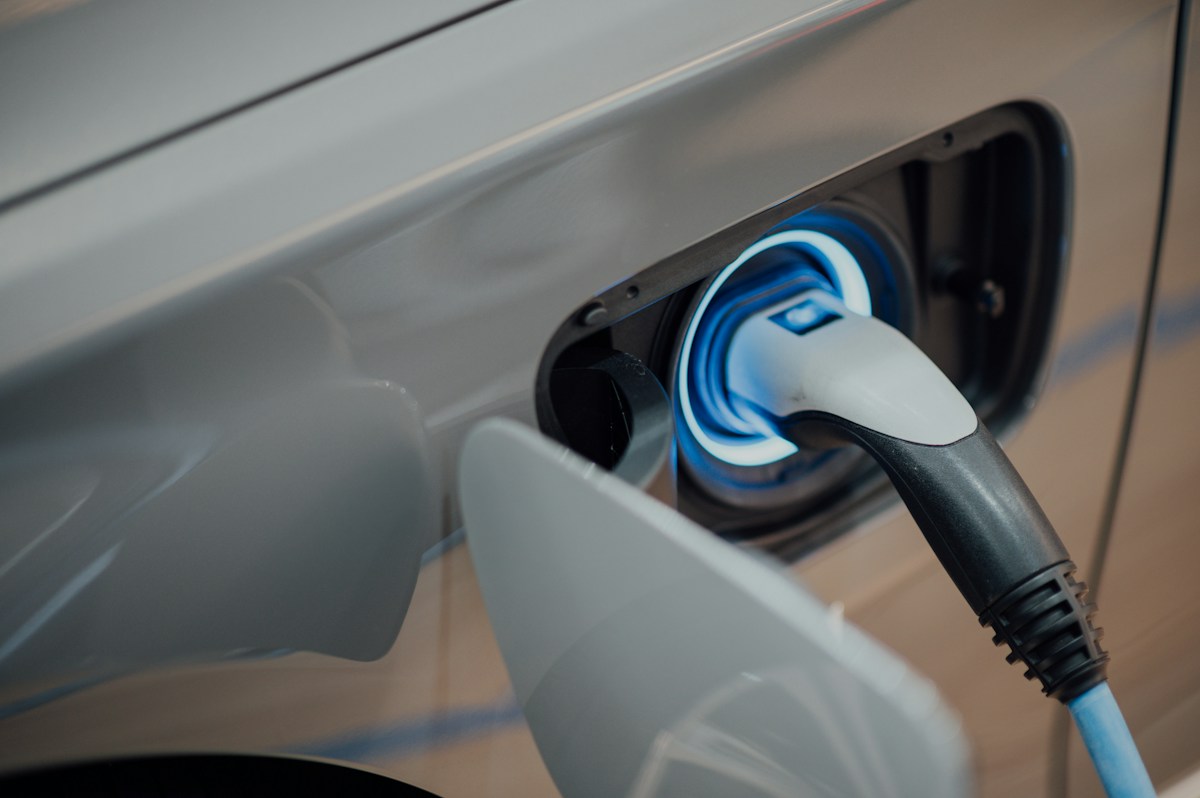 An electric car connected to a charging cable
