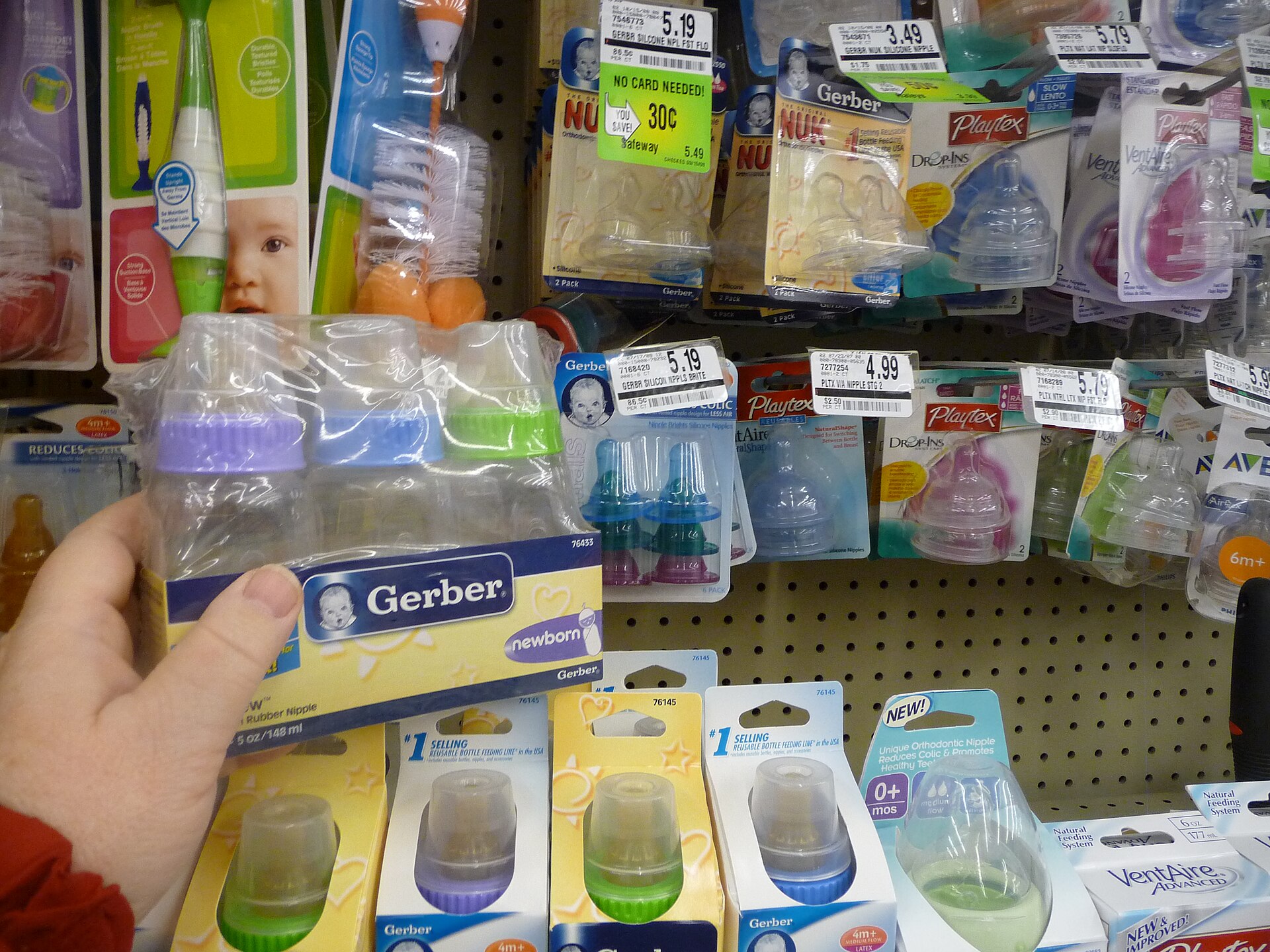 A row of baby bottles prepared for daytime feeding