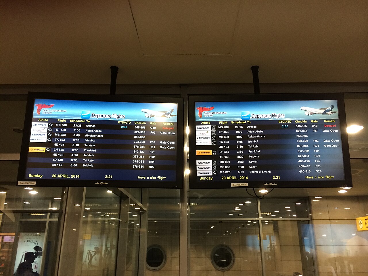 A departures board at Cairo airport showing flight listings