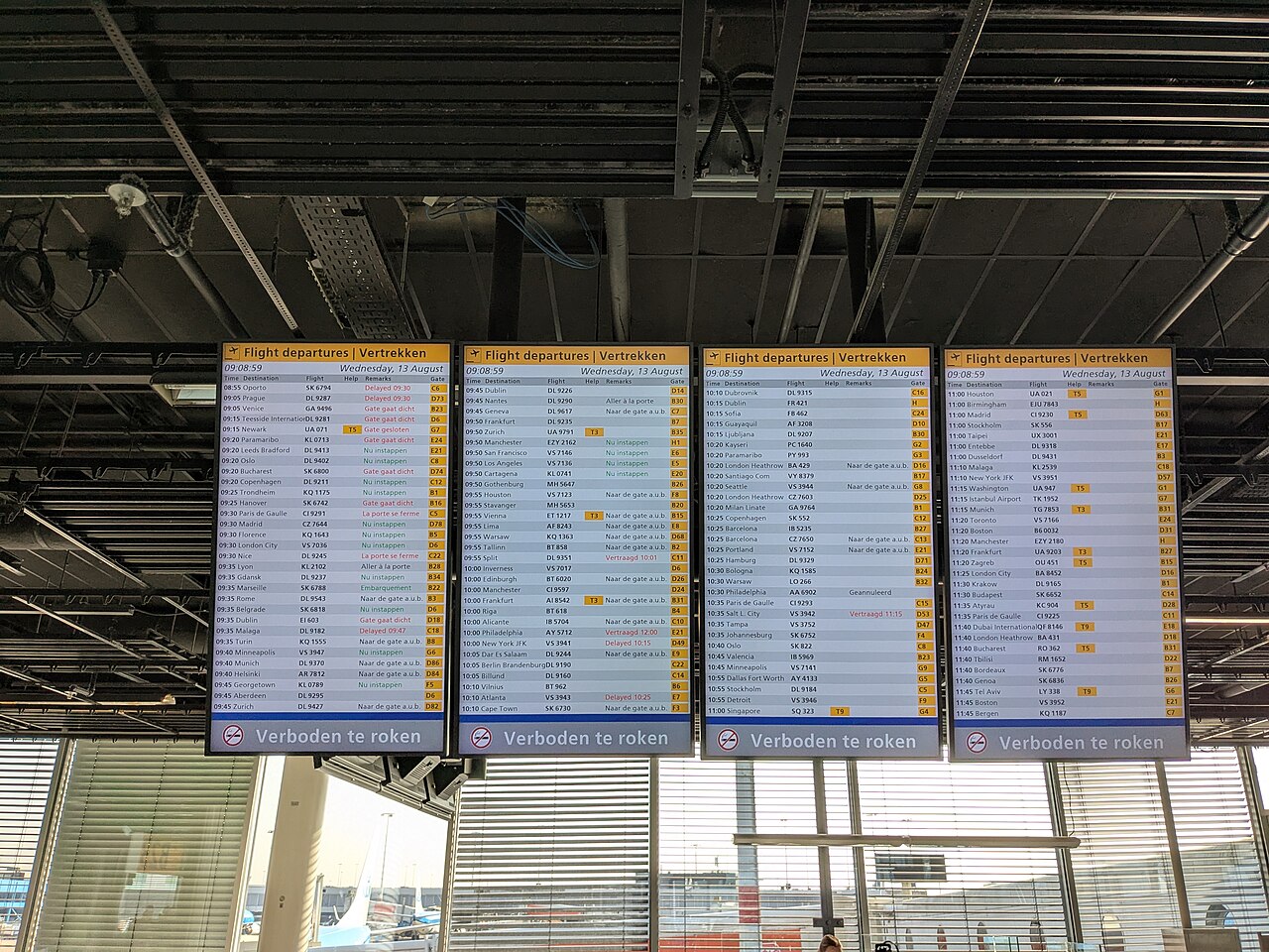 A departures board at Amsterdam Schiphol airport