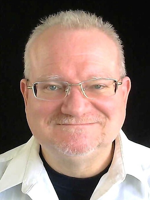 A clean headshot-style portrait, the framing a webcam sees