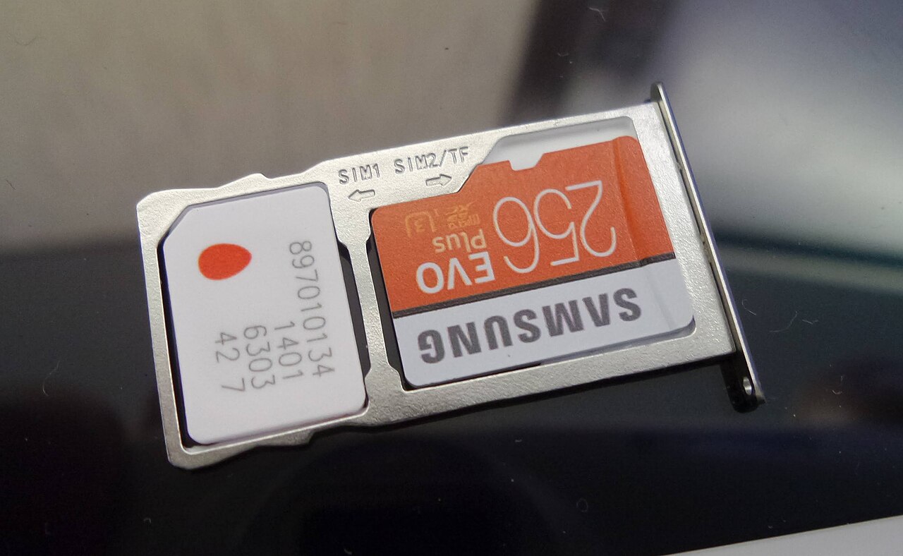SIM and memory cards beside a tablet