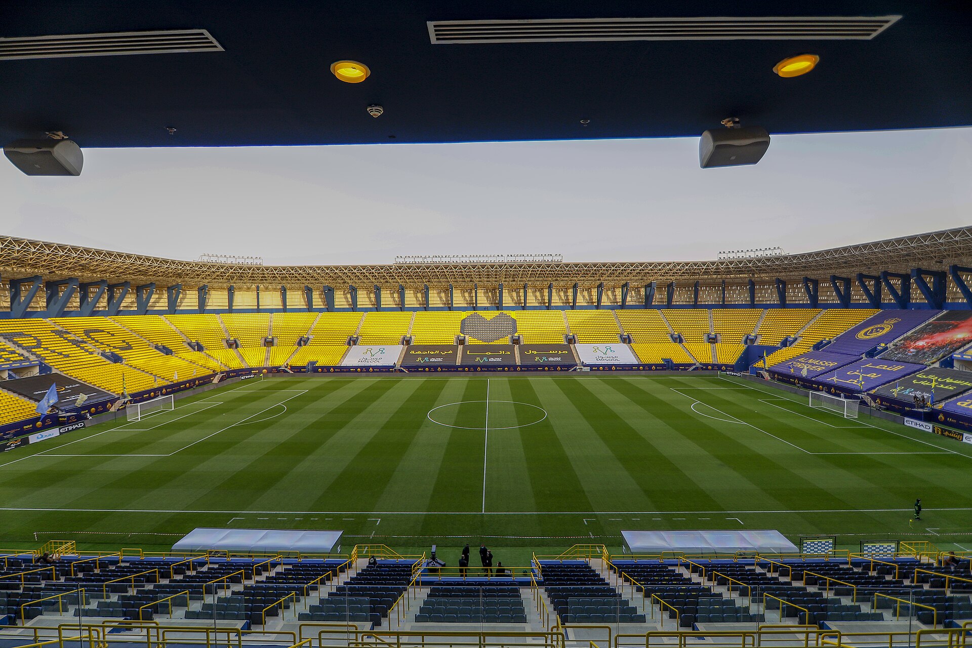 Inside view of the Al Awwal Park stadium showing the stands and pitch