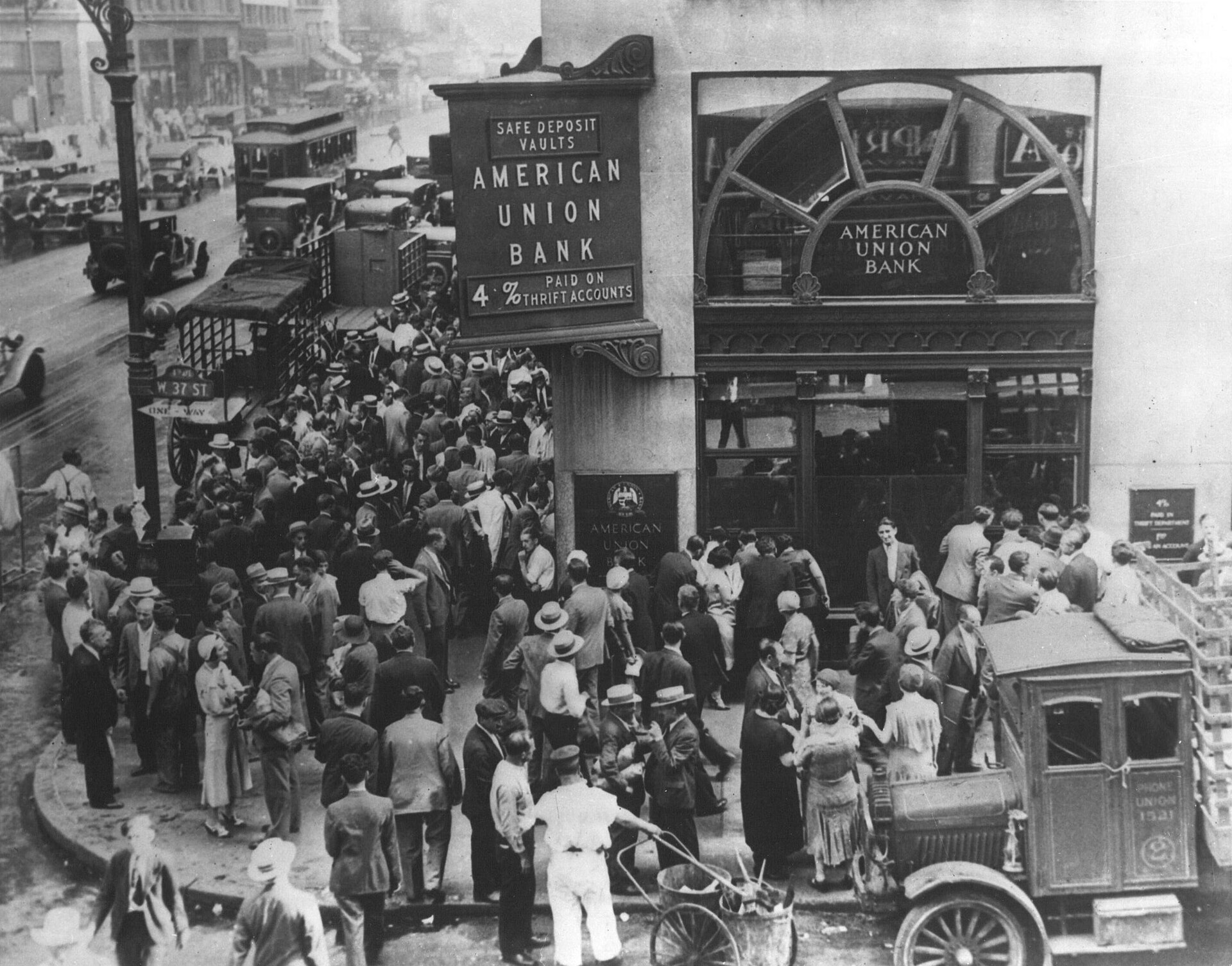 Historic photograph of a bank run, with crowds gathered outside a bank