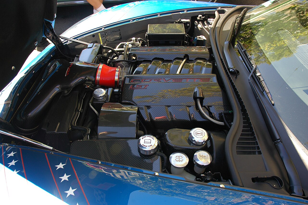 A clean, detailed engine bay with visible ignition and intake components