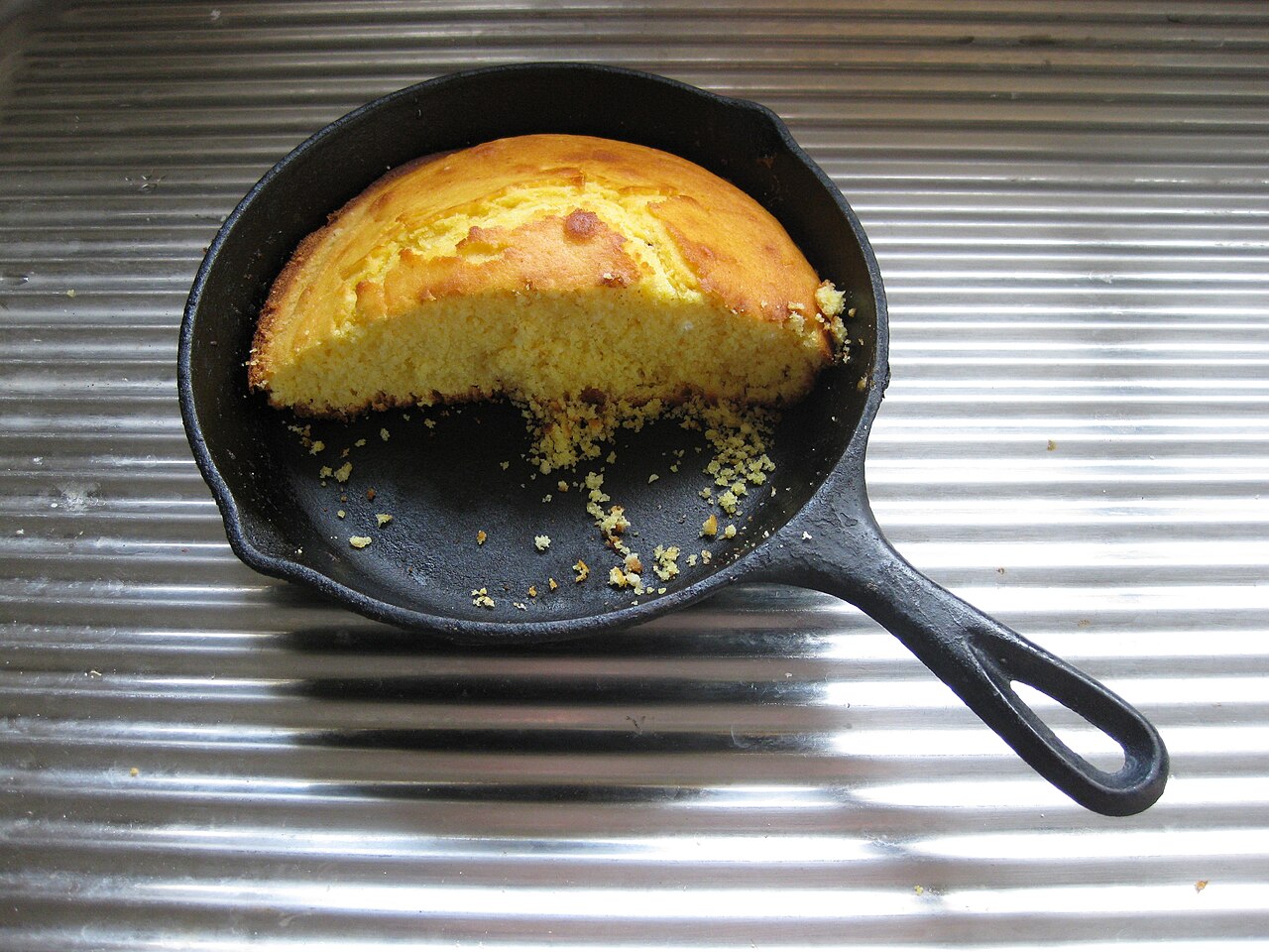 Cornbread baked in a cast iron pan