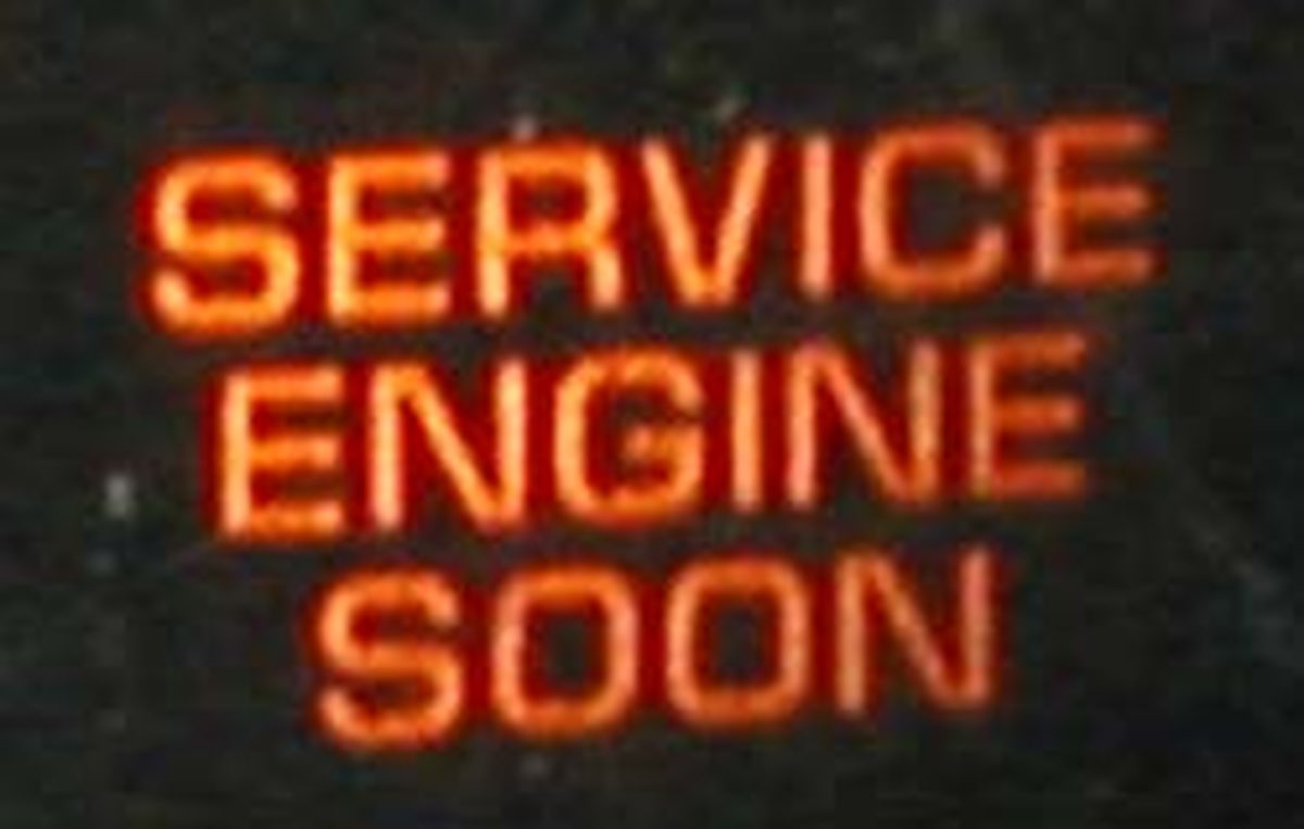 A check engine light symbol on a car dashboard