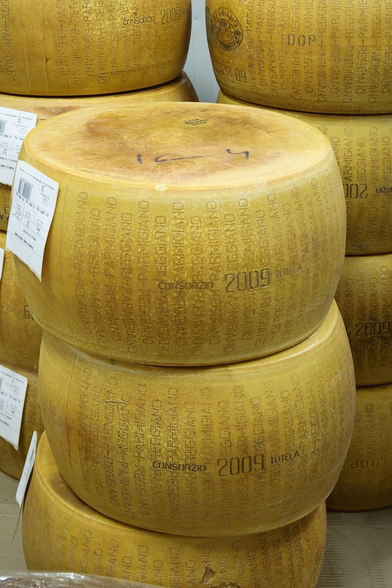 Wheels of Parmigiano Reggiano at a market