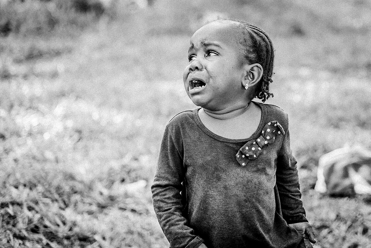 A toddler crying outdoors