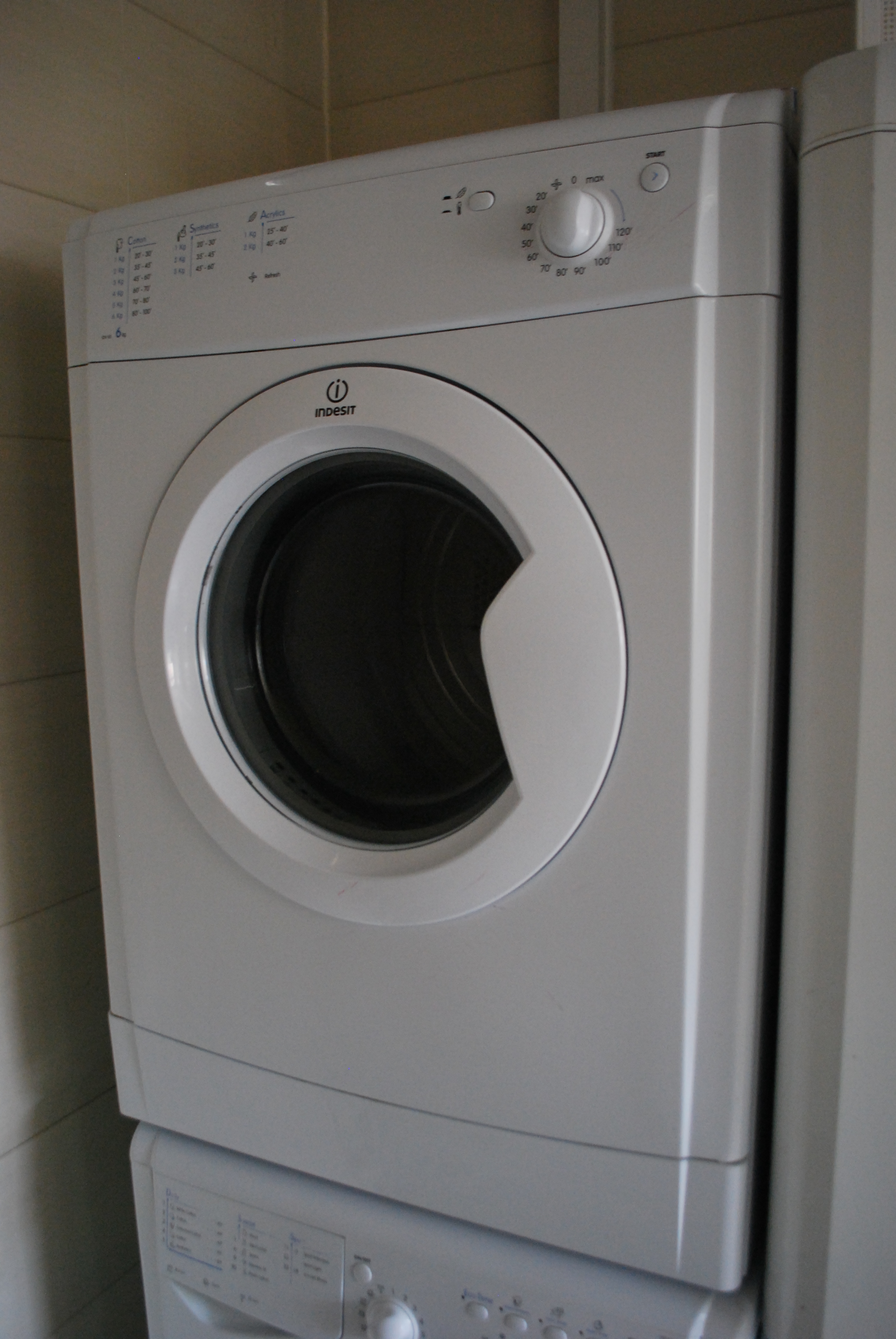 A tumble dryer in a laundry area