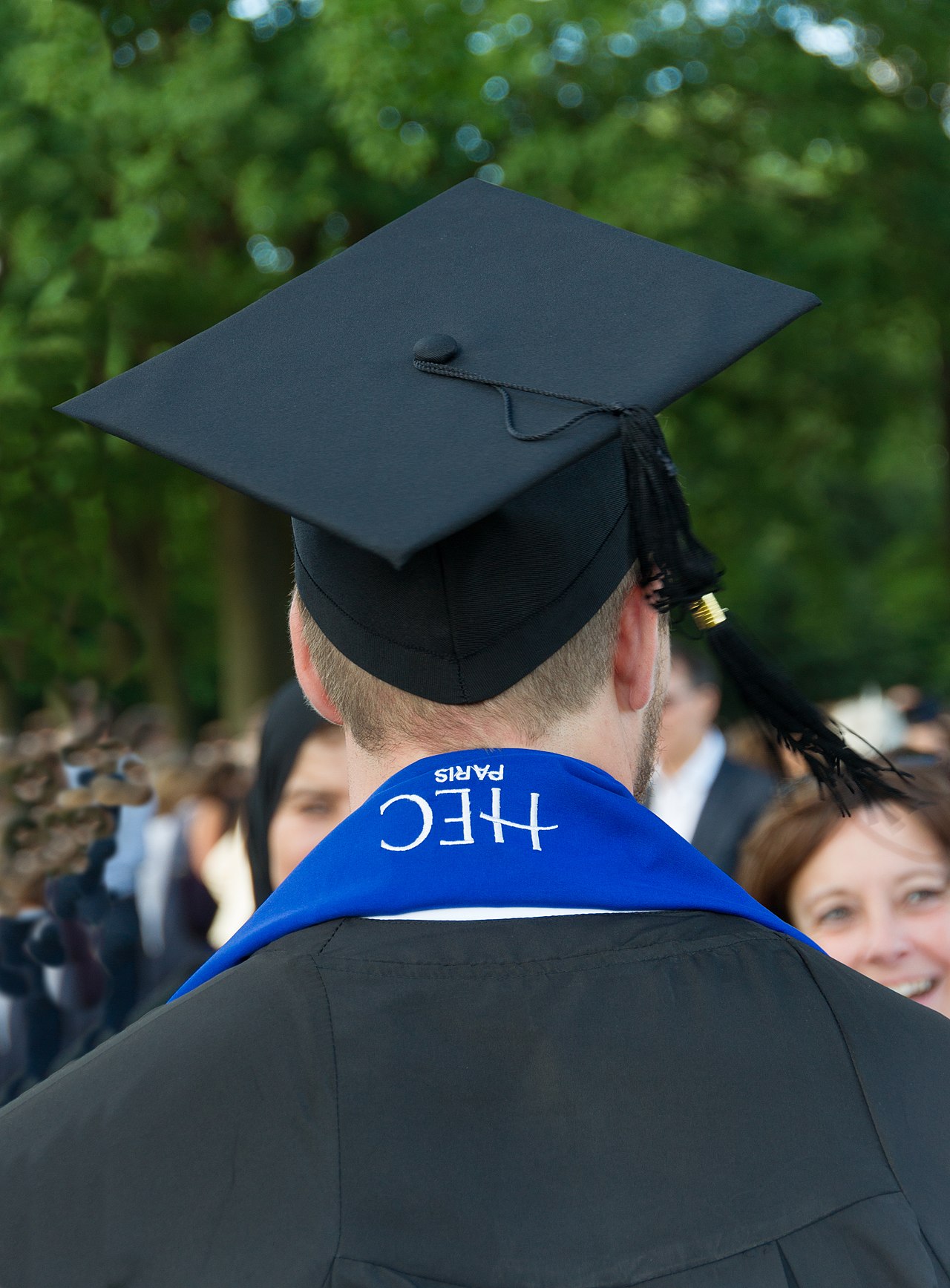 A university graduate smiling during a graduation event