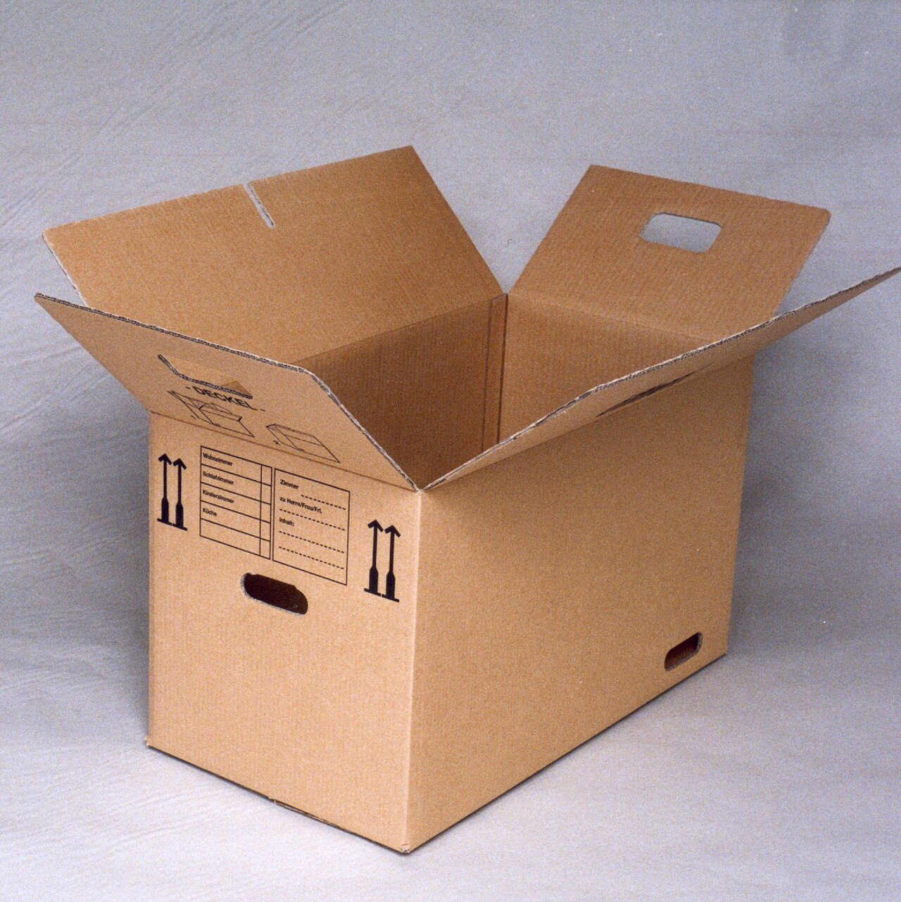A labeled cardboard moving box, representing the paperwork and decisions that come with moving retirement savings between plans