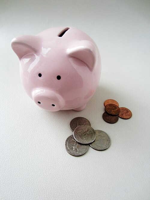 Coins and a small savings container, a reminder that the rollover decision protects money that took years to accumulate