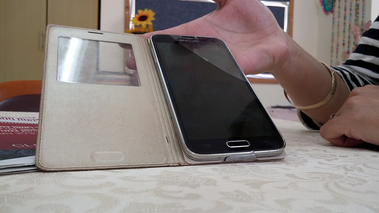 A cracked telephone screen close-up, a reminder to keep recovery options current