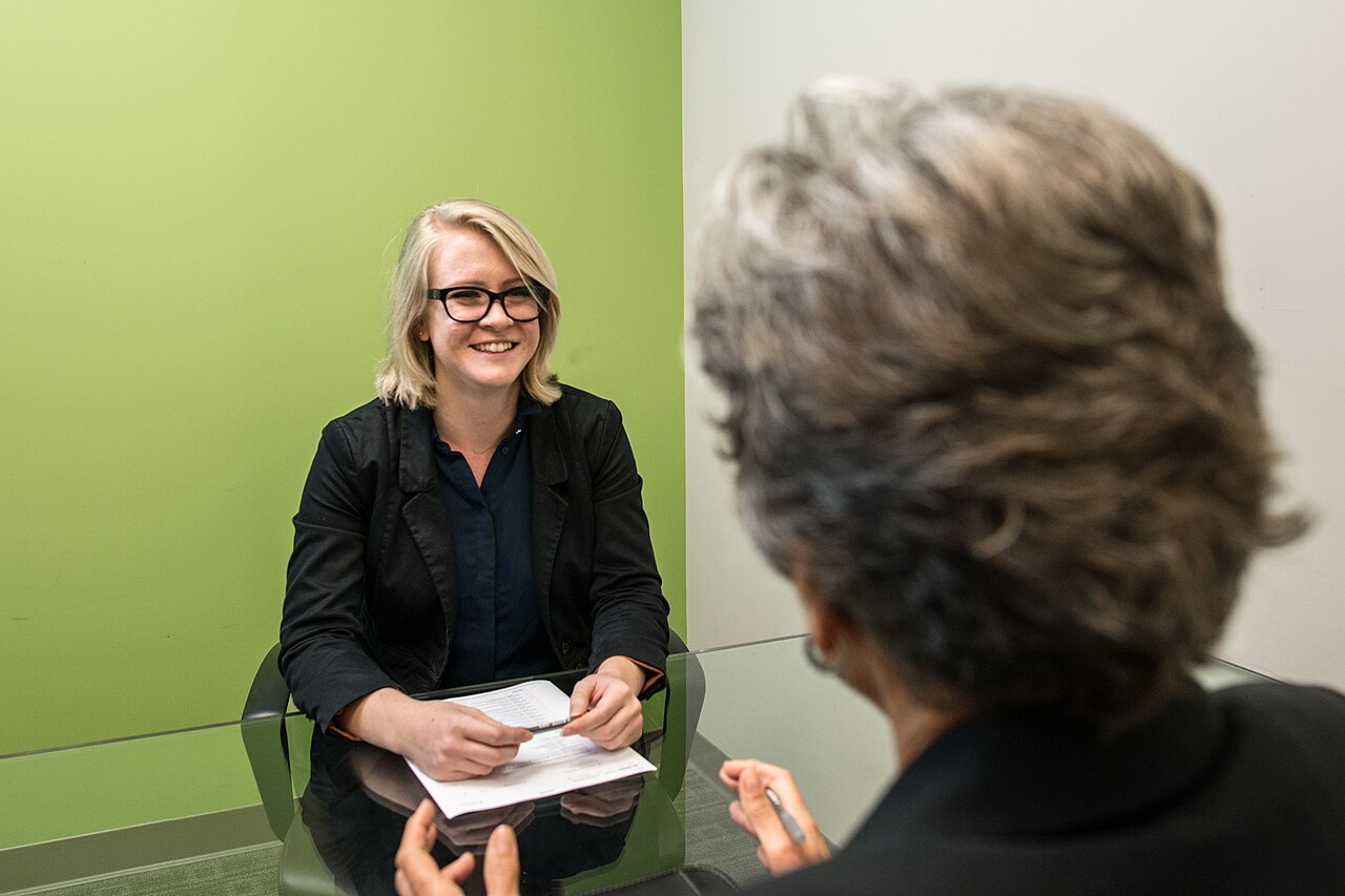 A woman answering questions during a job interview