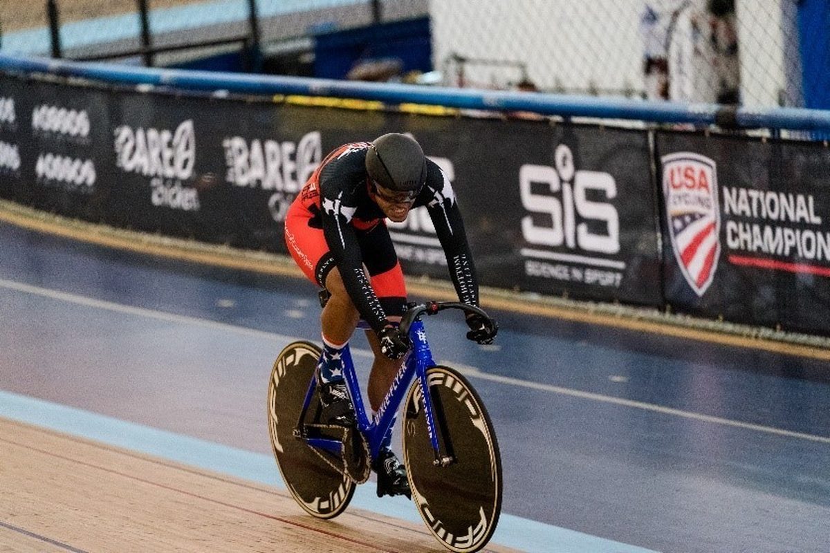 A cyclist sprinting during a team race