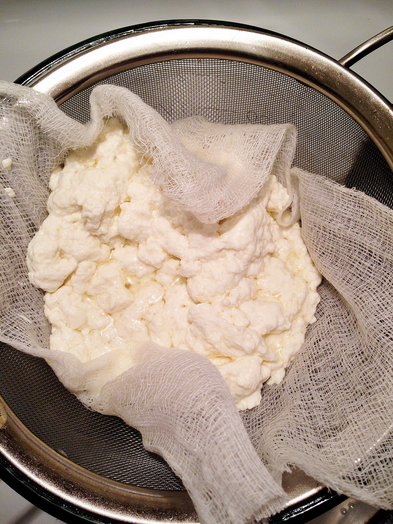 Fresh cheese curds in a container