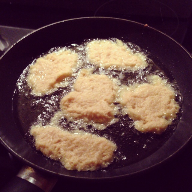 Pancakes cooking in a frying pan