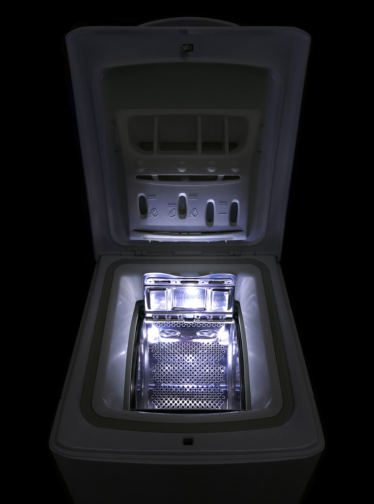 An open top-loading washing machine showing the drum and agitator area