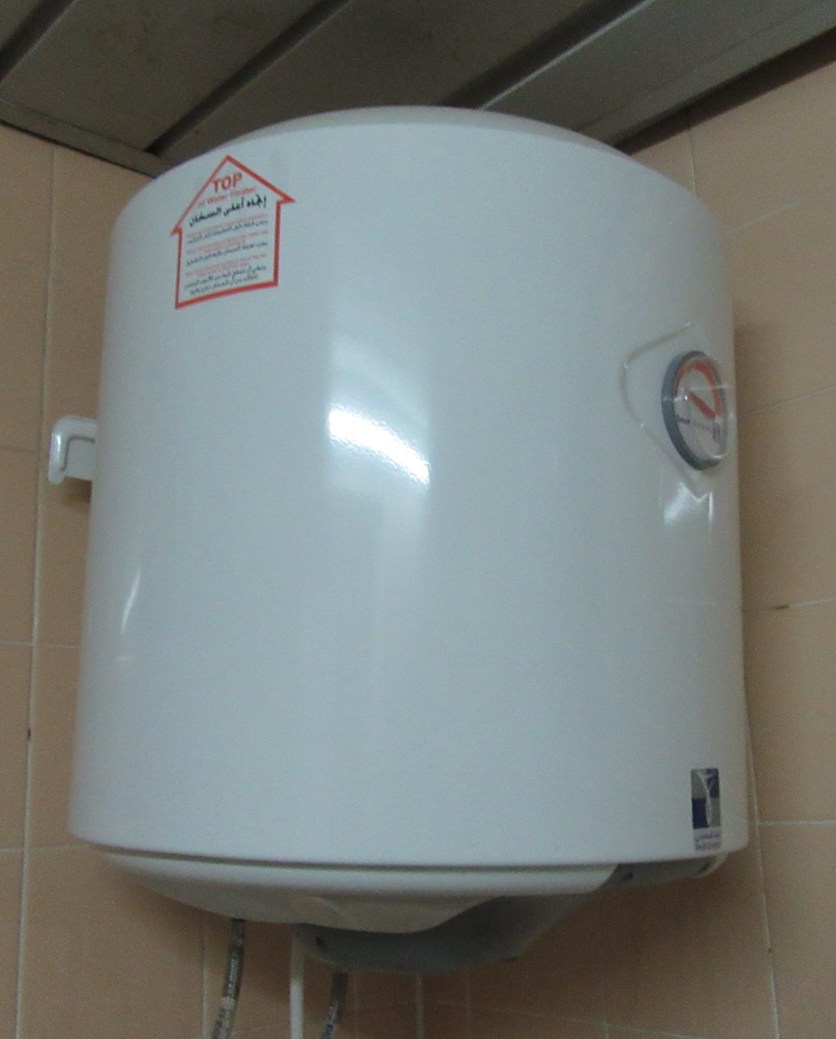 A compact white storage water heater