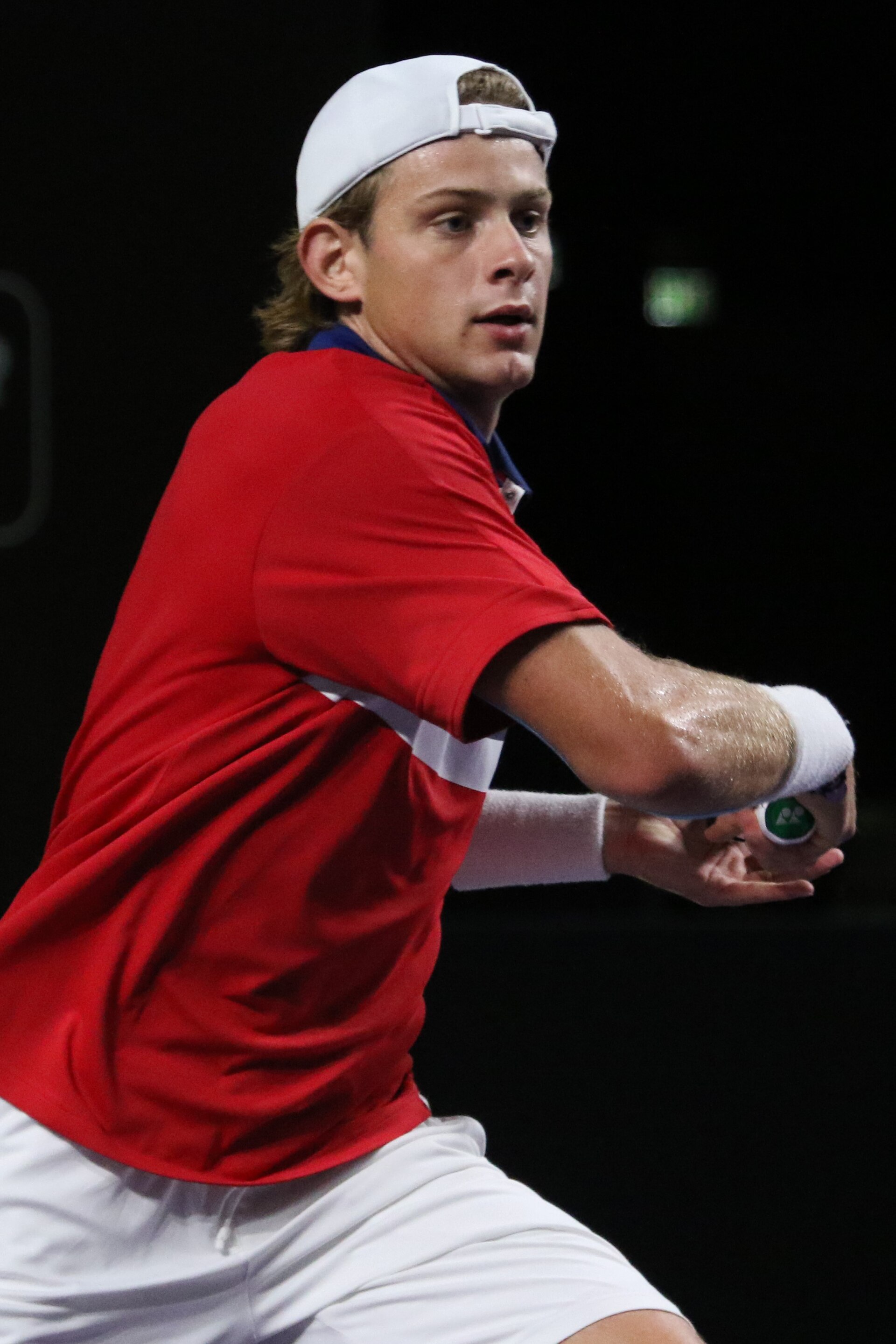 Zizou Bergs during a match, preparing to hit the ball