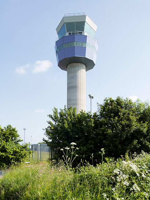 An air traffic control tower overlooking the airfield