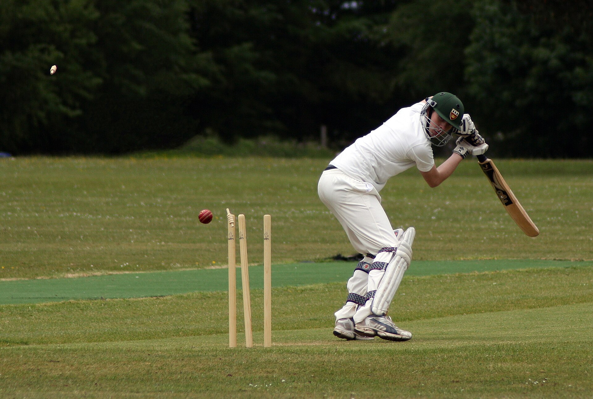 A batter is bowled during a cricket match
