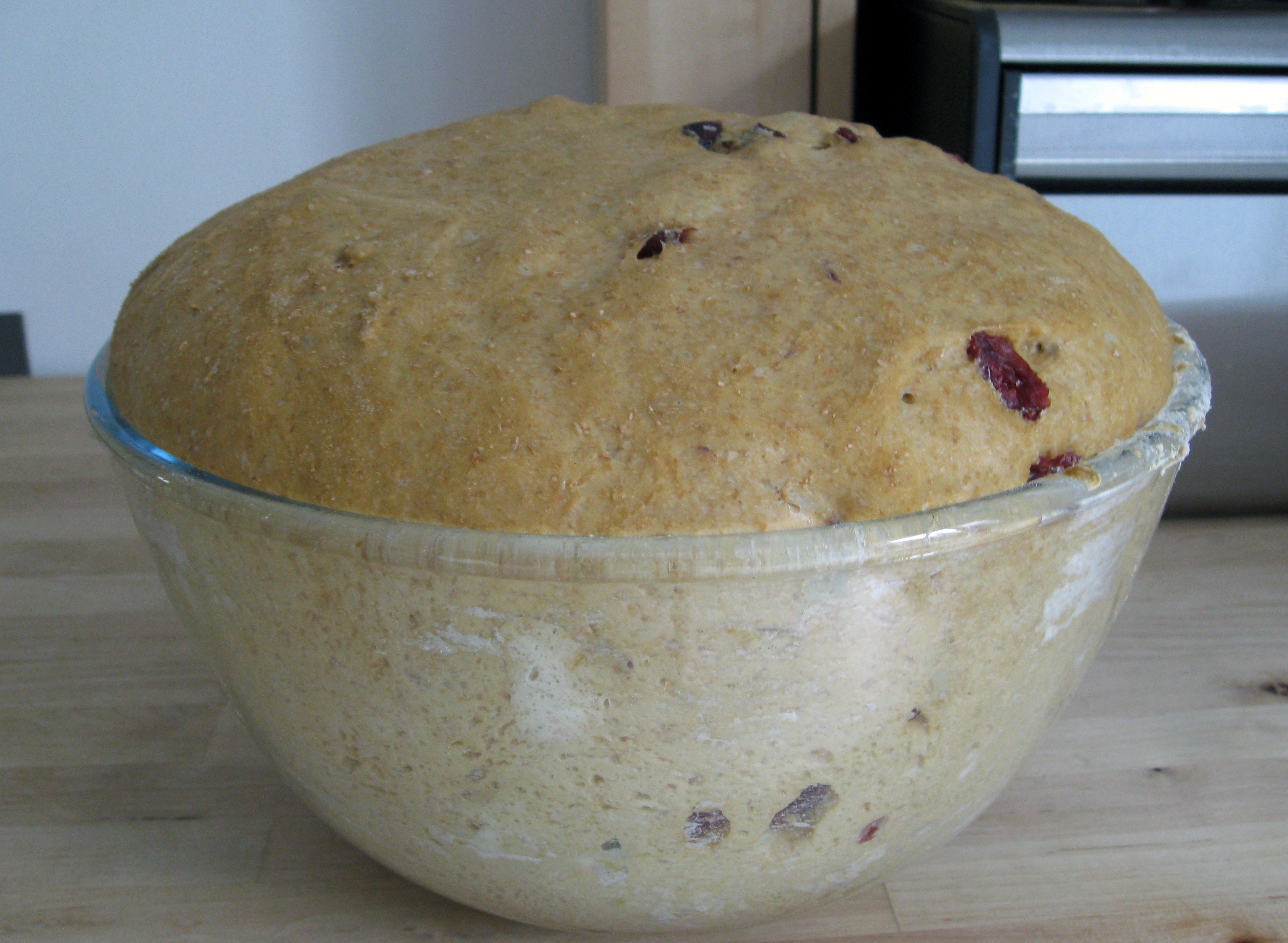 Risen bread dough resting in a bowl before shaping